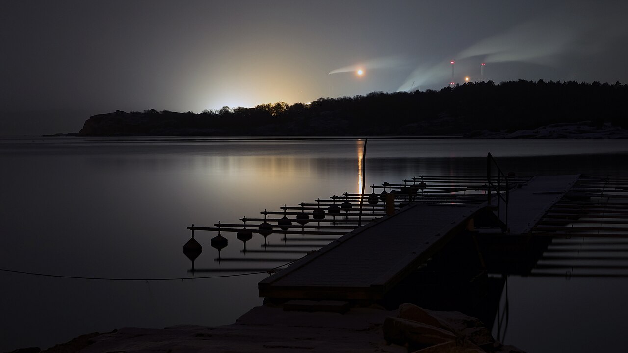 Oil refinery complex illuminated at night