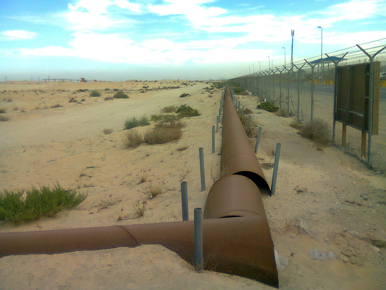 Oil pipelines crossing the desert near Jubail, Saudi Arabia
