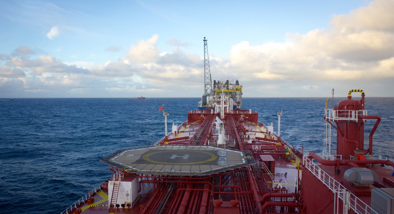 Crude oil tanker approaching an offshore FPSO unit